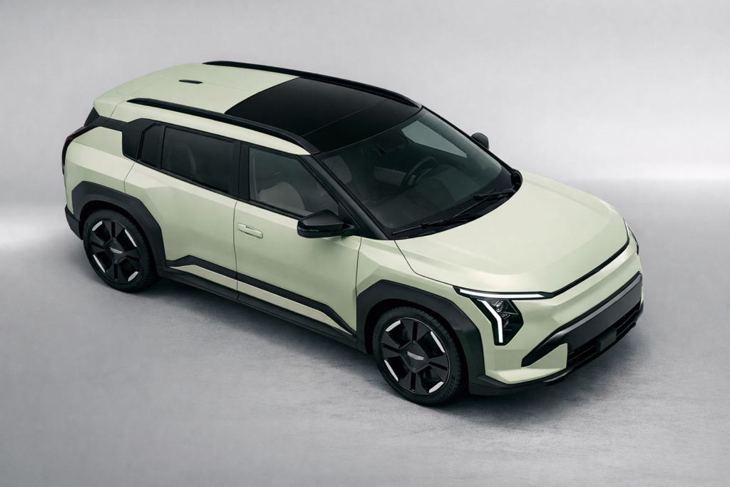 “Kia EV3 green electric compact SUV top angle view with black roof and modern LED headlights”
