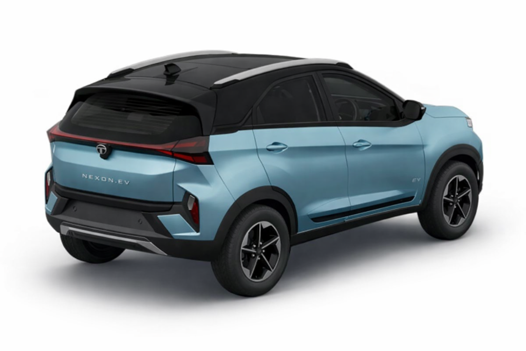 “Light blue Tata Nexon EV electric SUV with black roof, rear side view on white background.”