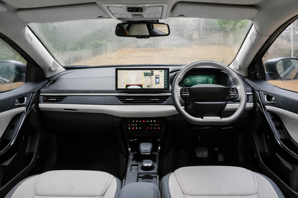 “Modern interior dashboard of Tata Nexon with digital display, steering wheel and touchscreen infotainment system.”